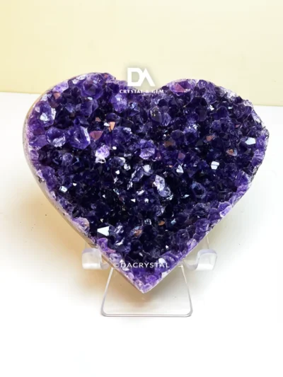 Heart-shaped Amethyst crystal with natural purple hues and a polished surface
