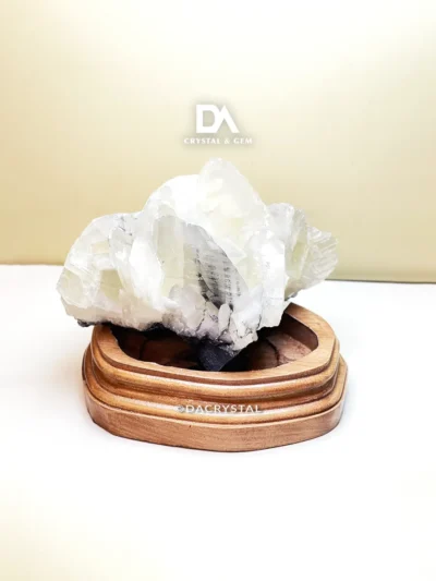 Natural Quartz crystal display featuring clear crystalline formations and a glassy surface