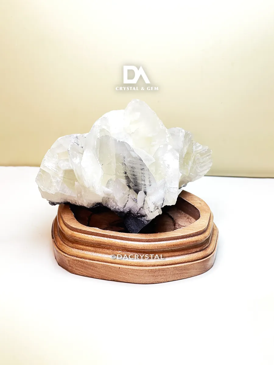Natural Quartz crystal display featuring clear crystalline formations and a glassy surface