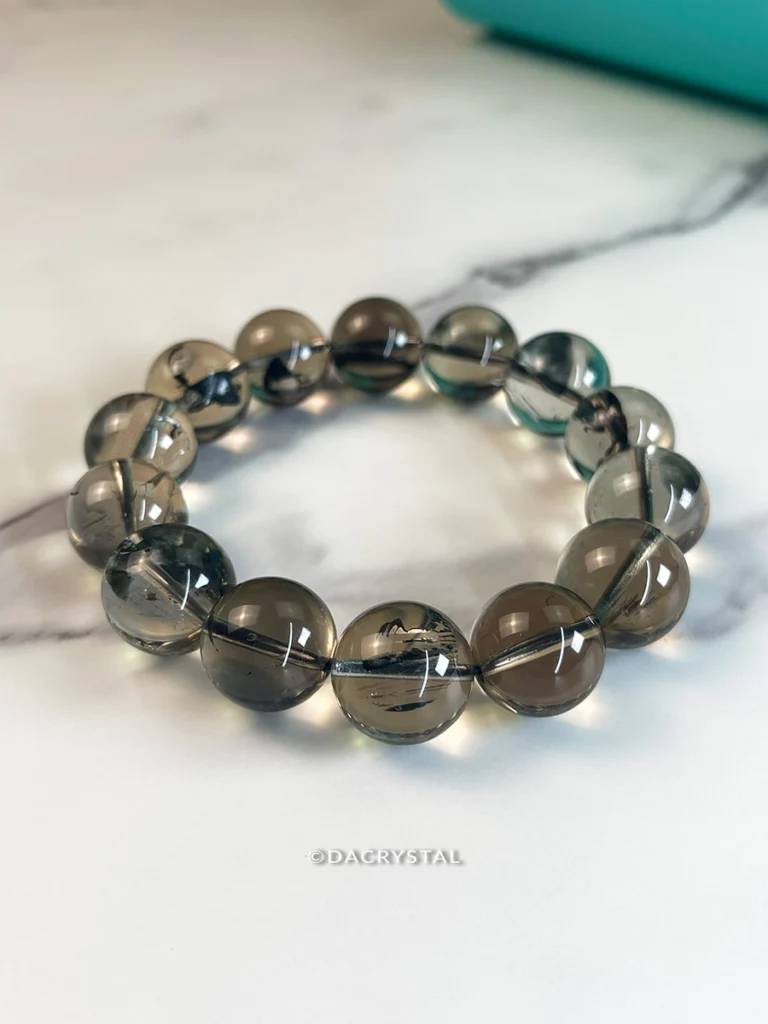 smoky-clear-quartz-webp Smoky Clear Quartz crystal bracelet with translucent grey tones for grounding and clarity
