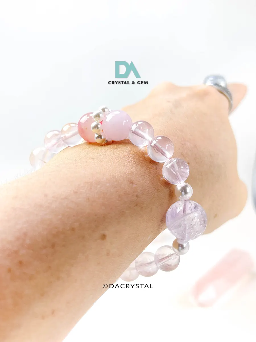 Harmonize your energy with the Celestial Harmony crystal bracelet. Choose Bloom (Sakura Rhodonite)